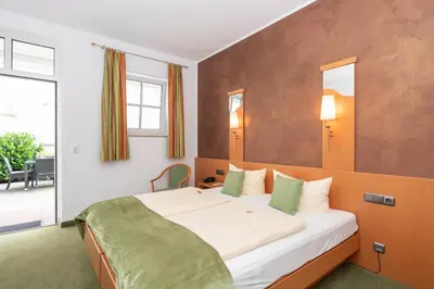 Ein Bett oder Betten in einem Zimmer der Unterkunft Hotel Bitburger Hof