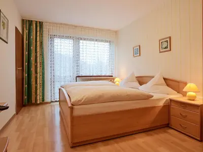 Ein Bett oder Betten in einem Zimmer der Unterkunft Pension zur Mühle