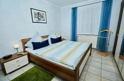 Ein Bett oder Betten in einem Zimmer der Unterkunft Ferienwohnung Leitges