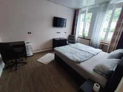 Ein Bett oder Betten in einem Zimmer der Unterkunft Gästehaus im Alten Fährhaus
