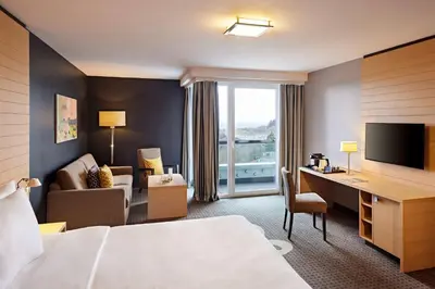 Ein Bett oder Betten in einem Zimmer der Unterkunft Nürburgring Congress Hotel