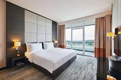 Ein Bett oder Betten in einem Zimmer der Unterkunft Nürburgring Congress Hotel