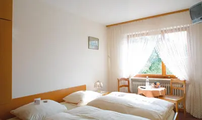 Ein Bett oder Betten in einem Zimmer der Unterkunft Pension Auf der Olk mit Röpertsmühle