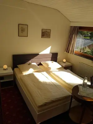 Ein Bett oder Betten in einem Zimmer der Unterkunft Pension Auf der Olk mit Röpertsmühle