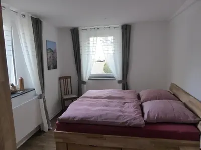 Ein Bett oder Betten in einem Zimmer der Unterkunft St. Petershof
