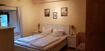 Ein Bett oder Betten in einem Zimmer der Unterkunft Neumühle