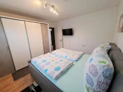 Ein Bett oder Betten in einem Zimmer der Unterkunft Ferienhaus Clarissa