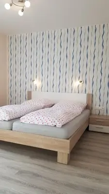 Ein Bett oder Betten in einem Zimmer der Unterkunft Ferienwohnungen Haus Talblick
