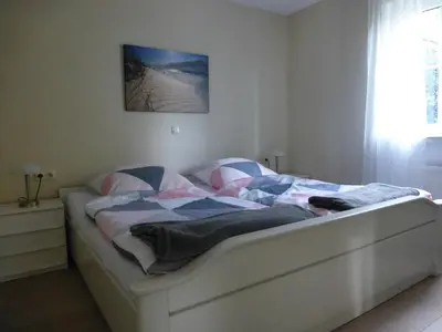 Ein Bett oder Betten in einem Zimmer der Unterkunft Ferienwohnung 