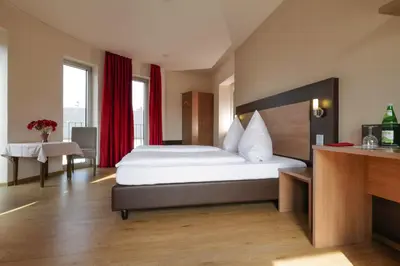 Ein Bett oder Betten in einem Zimmer der Unterkunft Hotel Moseldomizil