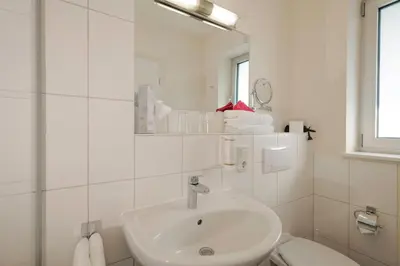 Ein Badezimmer in der Unterkunft Hotel Moseldomizil