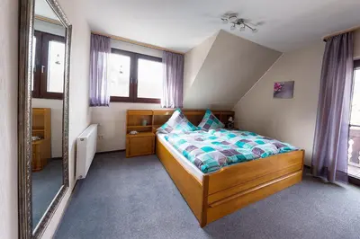 Ein Bett oder Betten in einem Zimmer der Unterkunft Ferienwohnung Maria Laach 2