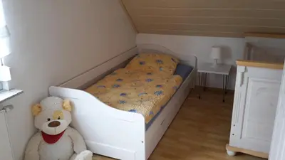 Ein Bett oder Betten in einem Zimmer der Unterkunft Ferienwohnung Braun