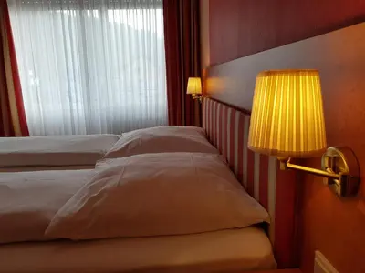 Ein Bett oder Betten in einem Zimmer der Unterkunft Hotel 