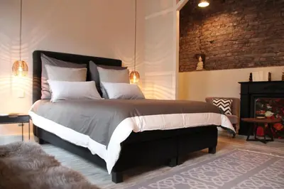 Ein Bett oder Betten in einem Zimmer der Unterkunft Exklusive Designferienwohnung The Backyard TBY 02