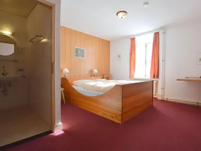 Ein Bett oder Betten in einem Zimmer der Unterkunft Urzig Heritage Riverside Stay
