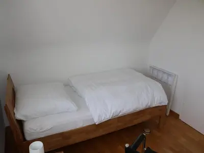 Ein Bett oder Betten in einem Zimmer der Unterkunft Villa Hochwald Familienhaus