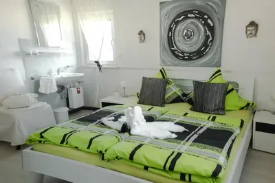 Ein Bett oder Betten in einem Zimmer der Unterkunft Gästehaus Edith, 3-Sterne, 2-4 Personen