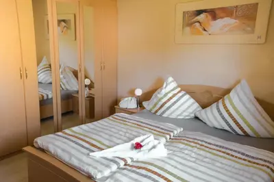 Ein Bett oder Betten in einem Zimmer der Unterkunft Gästehaus Edith, 3-Sterne, 2-4 Personen
