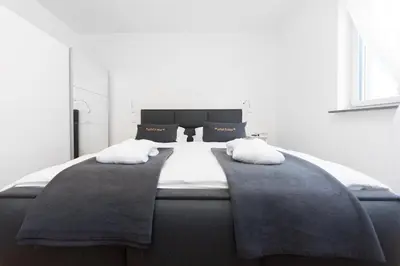 Ein Bett oder Betten in einem Zimmer der Unterkunft eifel5star - Burgfriedstraße