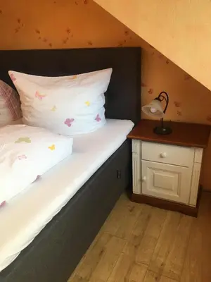 Ein Bett oder Betten in einem Zimmer der Unterkunft Ferienwohnung Sonnenlay