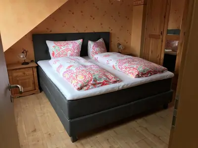 Ein Bett oder Betten in einem Zimmer der Unterkunft Ferienwohnung Sonnenlay