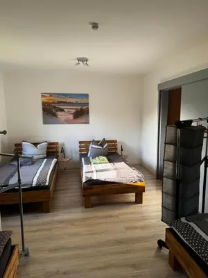 Ein Bett oder Betten in einem Zimmer der Unterkunft Ferienwohnung Distelkamp