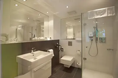 Ein Badezimmer in der Unterkunft Hotel Im Schulhaus