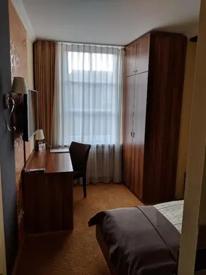 Ein Bett oder Betten in einem Zimmer der Unterkunft Dagstuhler Hof