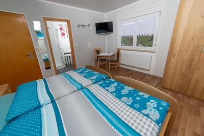Ein Bett oder Betten in einem Zimmer der Unterkunft Ferienwohnungen Schorn