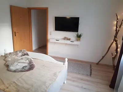 Ein Bett oder Betten in einem Zimmer der Unterkunft Rosenschlösschen