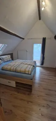 Ein Bett oder Betten in einem Zimmer der Unterkunft Ferienhaus an See