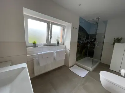 Ein Badezimmer in der Unterkunft Gaestehaus Kön - Fewo Farfalle