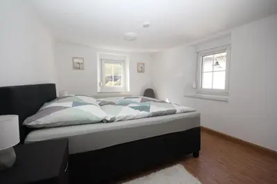 Ein Bett oder Betten in einem Zimmer der Unterkunft Ferienwohnung Ehlen im Alten Winzerhaus