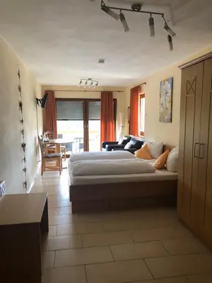 Ein Bett oder Betten in einem Zimmer der Unterkunft Hotel Berghof