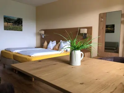 Ein Bett oder Betten in einem Zimmer der Unterkunft Hotel Berghof