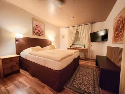 Ein Bett oder Betten in einem Zimmer der Unterkunft Landhaus Kürrenberg