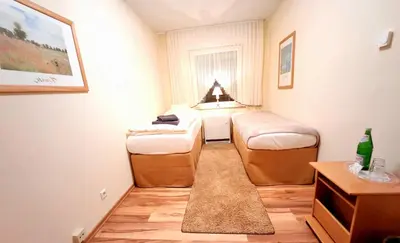 Ein Bett oder Betten in einem Zimmer der Unterkunft Landhaus Kürrenberg