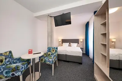 Ein Bett oder Betten in einem Zimmer der Unterkunft Sonnenuhr