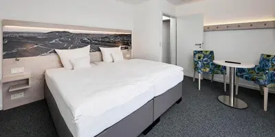 Ein Bett oder Betten in einem Zimmer der Unterkunft Sonnenuhr