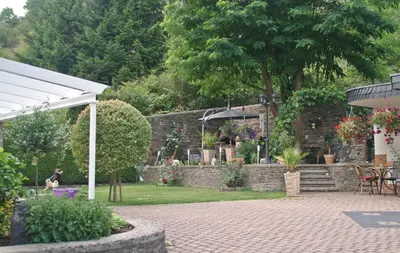 Ein Garten an der Unterkunft Pension Belzer