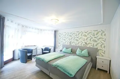 Ein Bett oder Betten in einem Zimmer der Unterkunft Pension Belzer