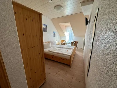 Ein Bett oder Betten in einem Zimmer der Unterkunft Hotel Ursula