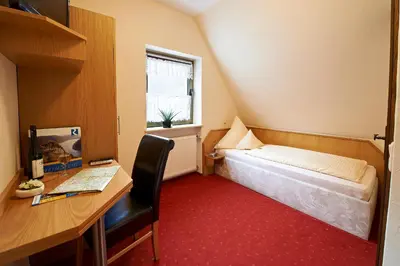 Ein Bett oder Betten in einem Zimmer der Unterkunft Hotel & Restaurant Krone