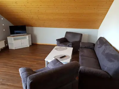 Ein Sitzbereich in der Unterkunft Ferienwohnung Kittel