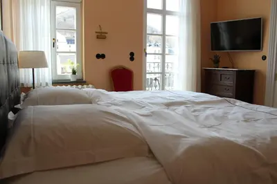Ein Bett oder Betten in einem Zimmer der Unterkunft Logierhaus Stadt Lyon