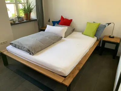 Ein Bett oder Betten in einem Zimmer der Unterkunft Stiftsherrenhaus