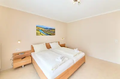 Ein Bett oder Betten in einem Zimmer der Unterkunft Gästehaus Binz-Meyer Heldensicht