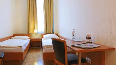 Ein Bett oder Betten in einem Zimmer der Unterkunft Hotel Deutsches Haus