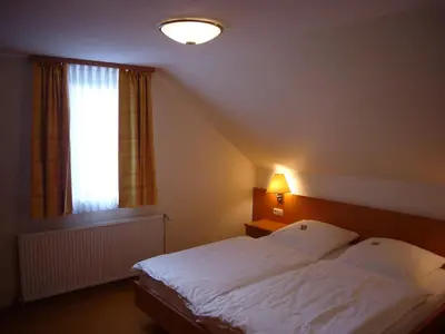 Ein Bett oder Betten in einem Zimmer der Unterkunft Hotel Deutsches Haus